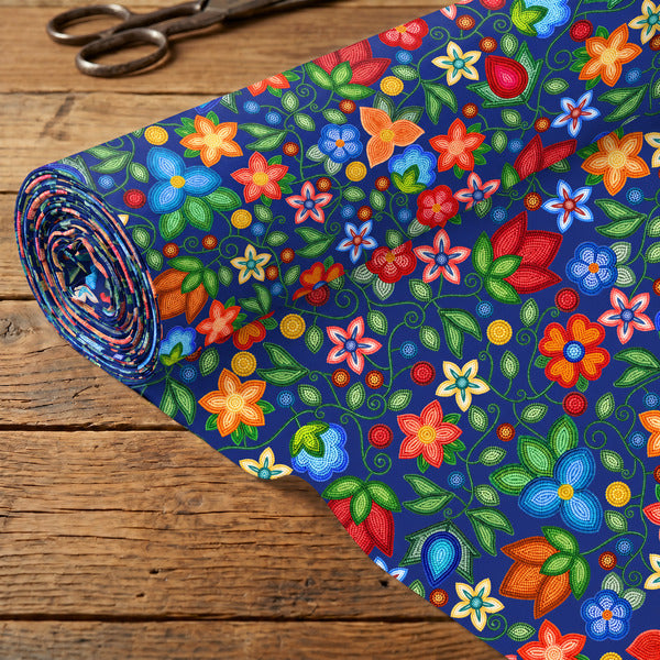 Morning Harmony Sapphire cotton poplin fabric rolled out on a wooden table